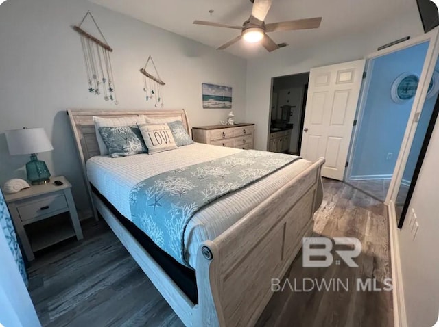 bedroom featuring ceiling fan and dark hardwood / wood-style flooring