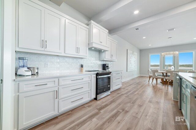 3238 Sea Horse Cir, Gulf Shores, AL 36542 - kitchen featuring white cabinets, appliances with stainless steel finishes, light countertops, decorative backsplash, and beamed ceiling