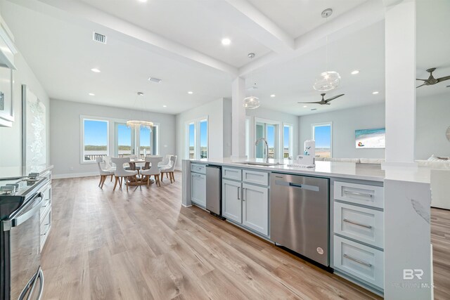 3238 Sea Horse Cir, Gulf Shores, AL 36542 - kitchen featuring a ceiling fan, electric range, visible vents, stainless steel dishwasher, and a sink