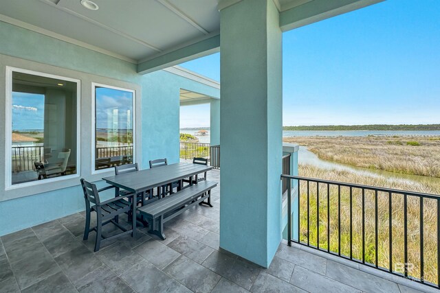 3238 Sea Horse Cir, Gulf Shores, AL 36542 - balcony featuring a water view and outdoor dining space