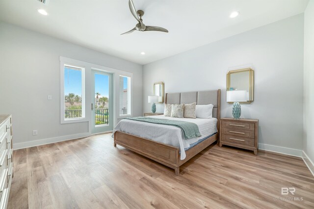 3238 Sea Horse Cir, Gulf Shores, AL 36542 - bedroom with baseboards, light wood-type flooring, and access to exterior