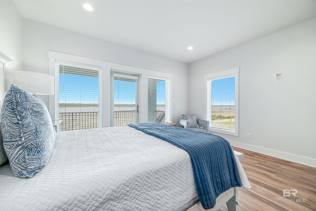 3238 Sea Horse Cir, Gulf Shores, AL 36542 - bedroom featuring recessed lighting, baseboards, and wood finished floors