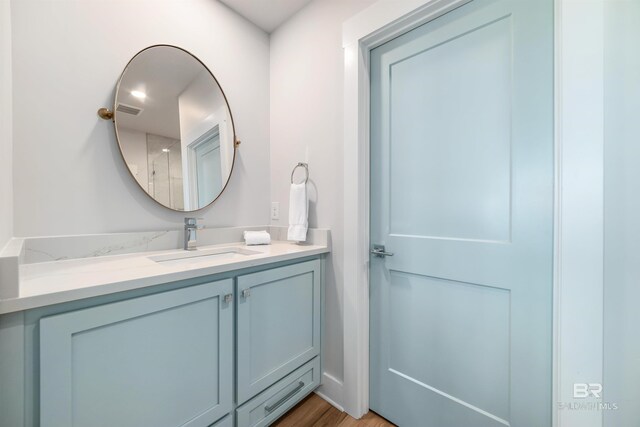 3238 Sea Horse Cir, Gulf Shores, AL 36542 - bathroom featuring vanity, wood finished floors, and visible vents