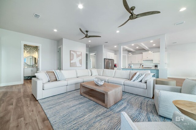 3238 Sea Horse Cir, Gulf Shores, AL 36542 - living room with baseboards, a ceiling fan, wood finished floors, and visible vents