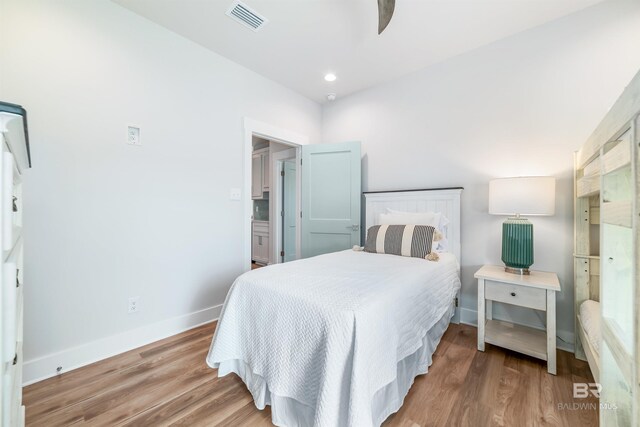 3238 Sea Horse Cir, Gulf Shores, AL 36542 - bedroom with recessed lighting, baseboards, visible vents, and wood finished floors