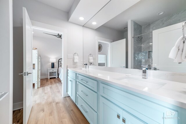 3238 Sea Horse Cir, Gulf Shores, AL 36542 - full bathroom featuring double vanity, walk in shower, a sink, and wood finished floors