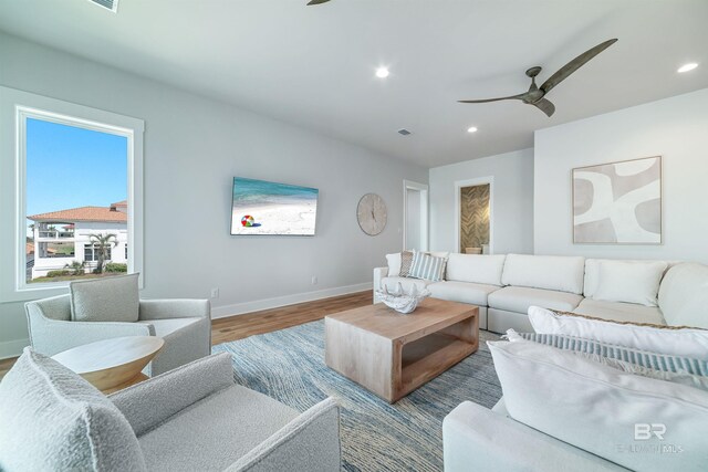 3238 Sea Horse Cir, Gulf Shores, AL 36542 - living room with visible vents, wood finished floors, baseboards, recessed lighting, and a ceiling fan
