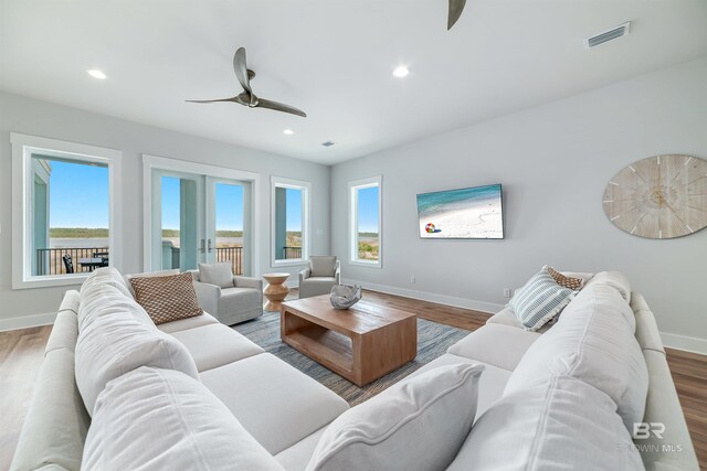 3238 Sea Horse Cir, Gulf Shores, AL 36542 - living room featuring baseboards, ceiling fan, and visible vents
