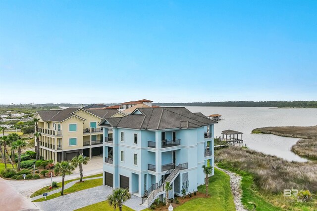 3238 Sea Horse Cir, Gulf Shores, AL 36542 - exterior space with a water view, an attached garage, and driveway