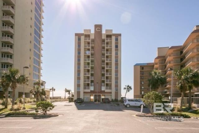 517 E Beach Blvd Unit 1B, Gulf Shores, AL 36542 - view of apartment building / complex featuring uncovered parking