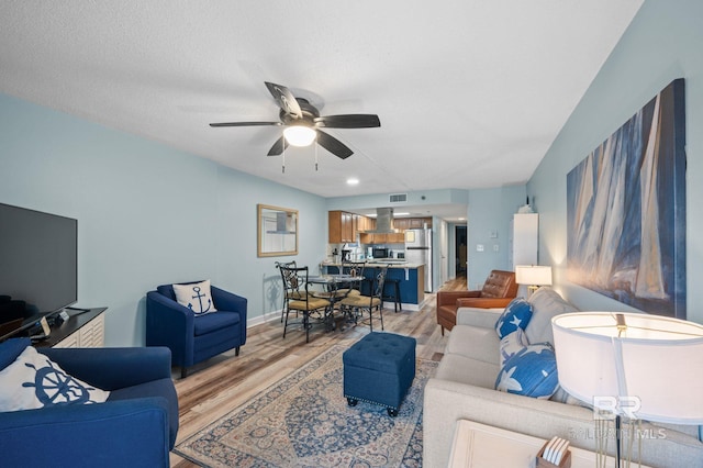 517 E Beach Blvd Unit 1B, Gulf Shores, AL 36542 - living area featuring light wood-style floors and a ceiling fan