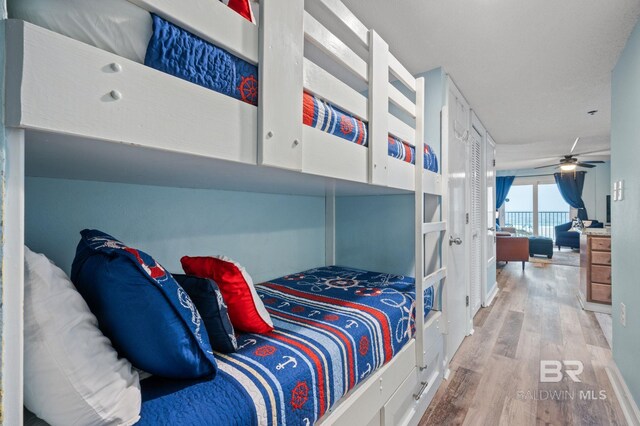 517 E Beach Blvd Unit 1B, Gulf Shores, AL 36542 - bedroom with wood finished floors and french doors