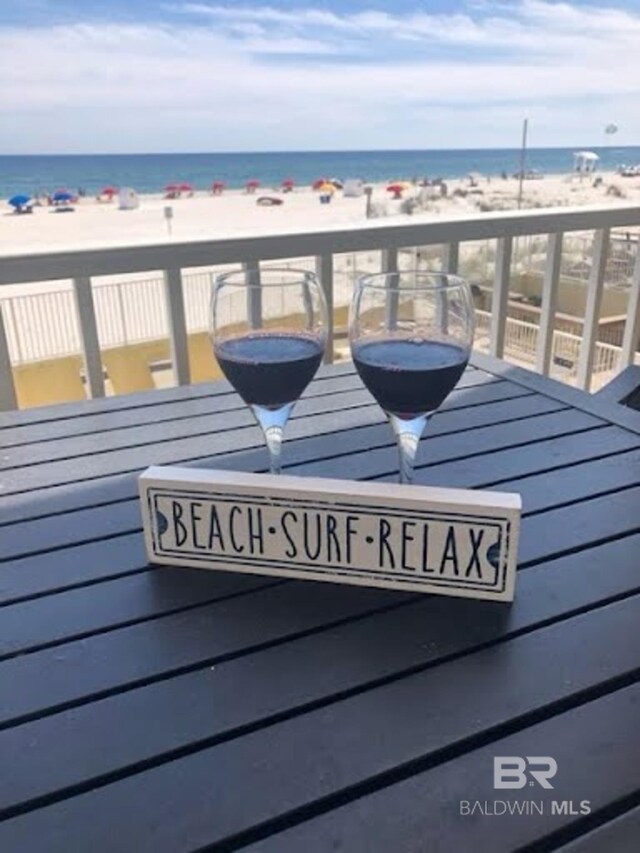 517 E Beach Blvd Unit 1B, Gulf Shores, AL 36542 - wooden deck with view of water and beach