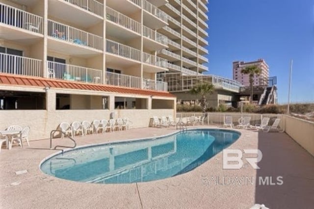 517 E Beach Blvd Unit 1B, Gulf Shores, AL 36542 - community pool with a patio area