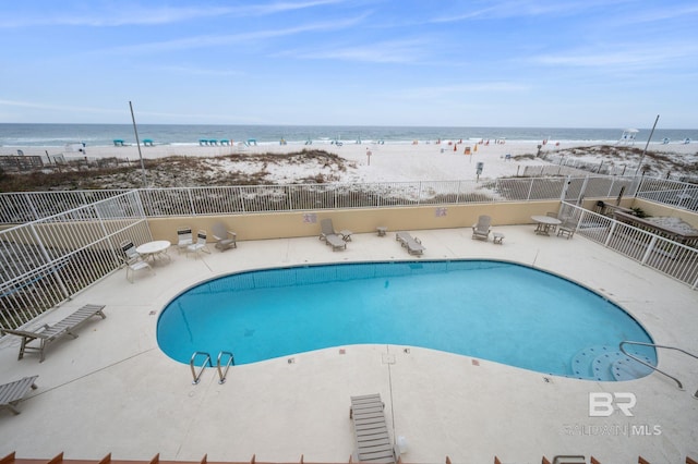 517 E Beach Blvd Unit 1B, Gulf Shores, AL 36542 - community pool with view of water and beach and a patio area