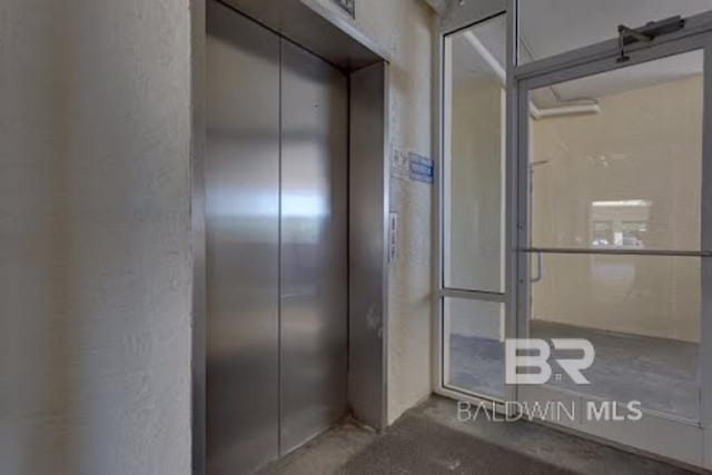 517 E Beach Blvd Unit 1B, Gulf Shores, AL 36542 - bathroom with elevator and a shower with door