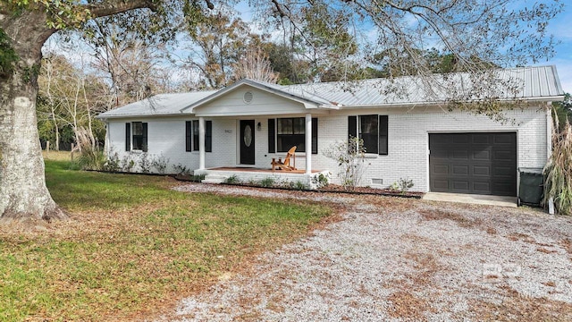 ranch-style home with a front lawn, a porch, and a garage