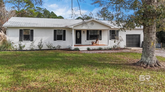 single story home featuring a front lawn, a porch, and a garage