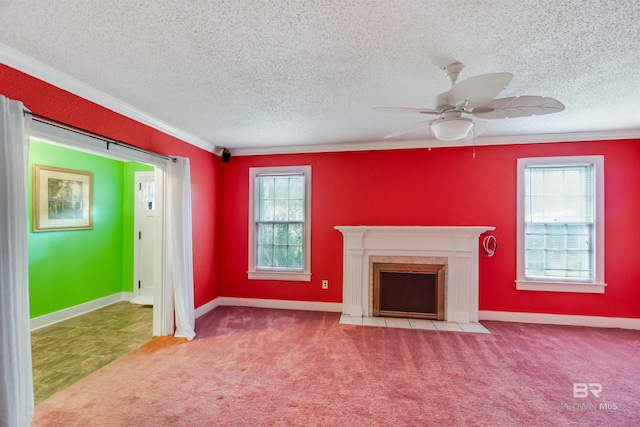 unfurnished living room featuring ceiling fan, light colored carpet, a fireplace, and a textured ceiling