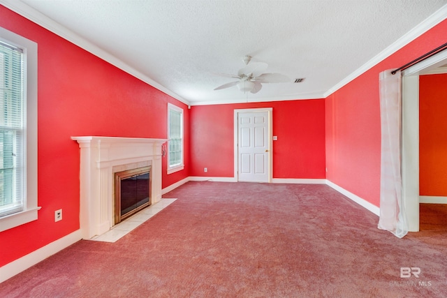 unfurnished living room featuring light carpet, crown molding, plenty of natural light, and ceiling fan