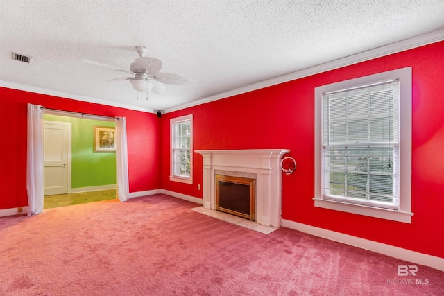 unfurnished living room with ceiling fan, light colored carpet, and a textured ceiling