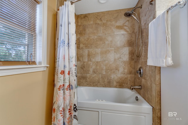 bathroom featuring shower / bathtub combination with curtain