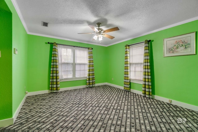 unfurnished room featuring ornamental molding, a textured ceiling, ceiling fan, and carpet