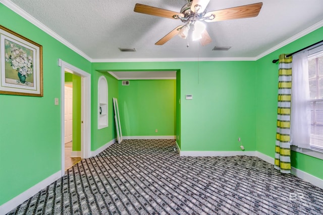 unfurnished room featuring ceiling fan, ornamental molding, a textured ceiling, and carpet floors