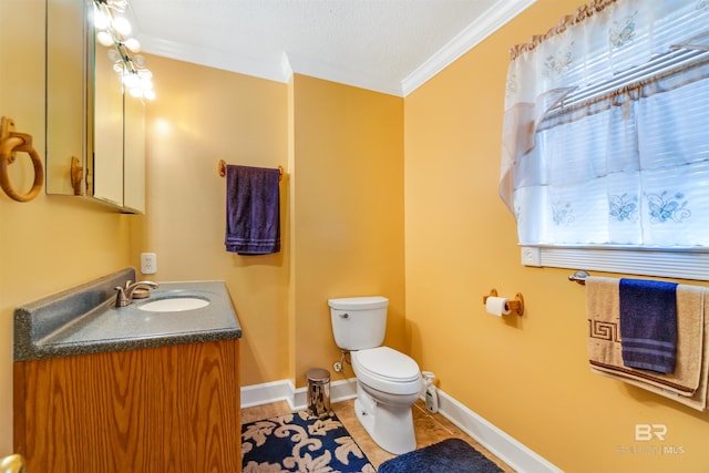 bathroom with crown molding, tile patterned floors, toilet, vanity, and a textured ceiling