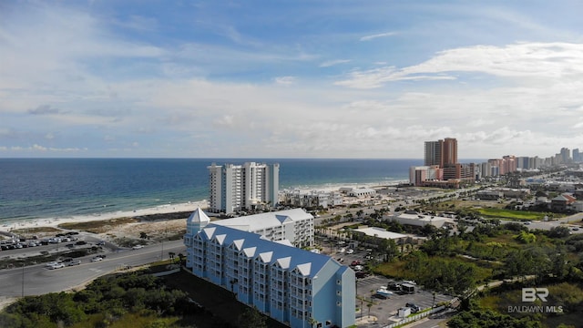 drone / aerial view featuring a water view and a beach view