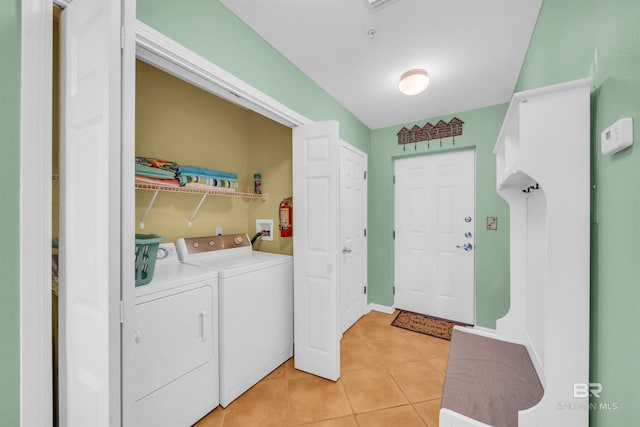 washroom featuring light tile patterned flooring and independent washer and dryer