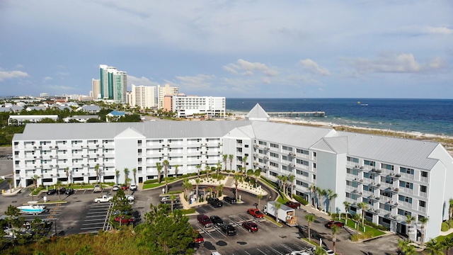 bird's eye view featuring a water view and a view of the beach