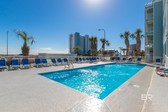 view of swimming pool featuring a patio