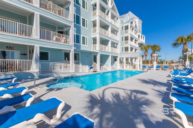 view of swimming pool featuring a patio area