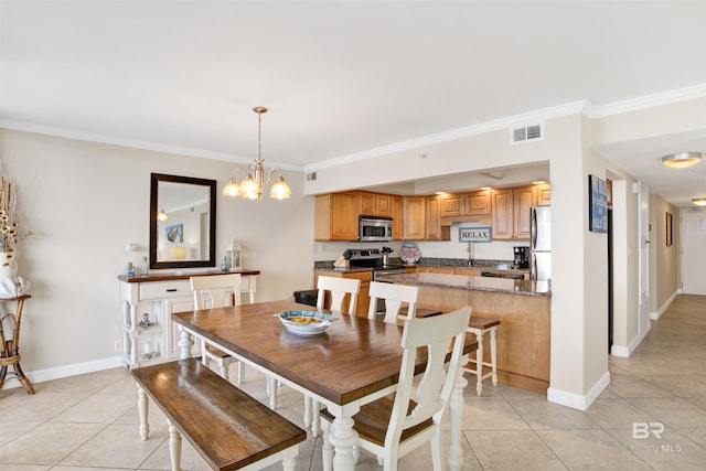 dining area with light tile patterned floors, a notable chandelier, sink, and crown molding