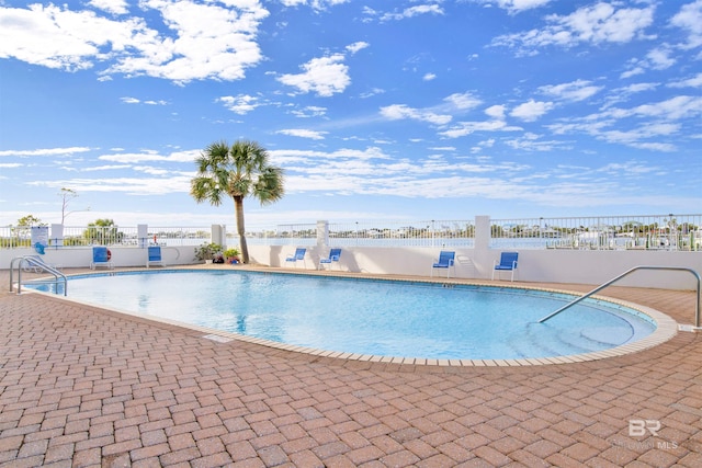 view of pool featuring a patio area