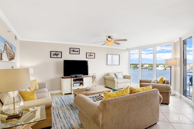 living room with ceiling fan, light tile patterned floors, ornamental molding, and expansive windows