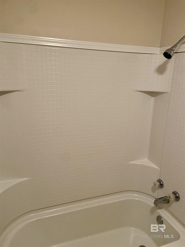 bathroom with shower / tub combination