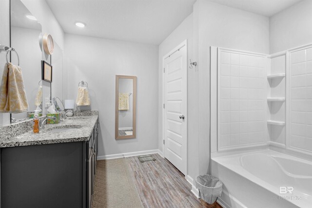 10804 Burlington Way, Mobile, AL 36608 - full bath with double vanity, shower / tub combination, wood finished floors, and recessed lighting