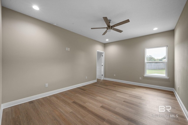 unfurnished room featuring ceiling fan and light hardwood / wood-style flooring