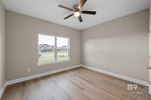 unfurnished room with light wood-type flooring and ceiling fan