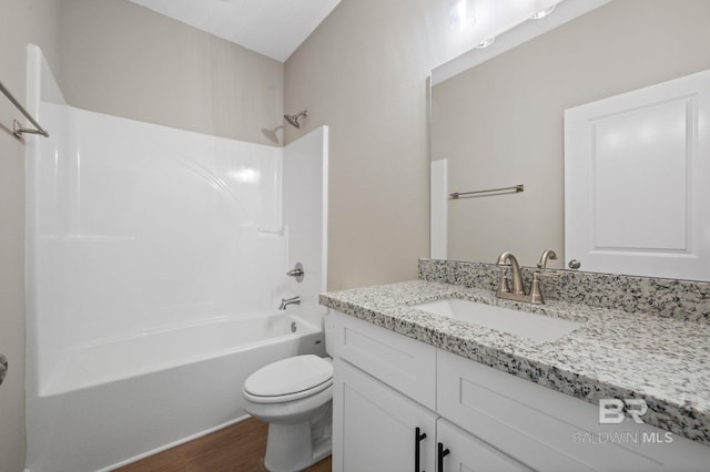 full bathroom featuring toilet, bathtub / shower combination, vanity, and wood-type flooring