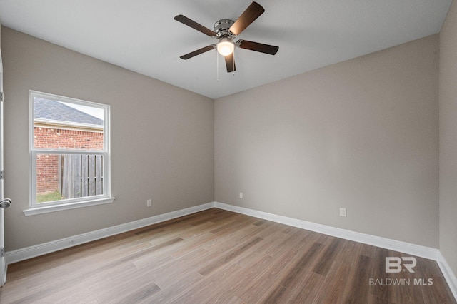 empty room with light hardwood / wood-style flooring and ceiling fan