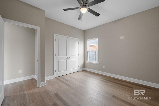 unfurnished bedroom with light hardwood / wood-style flooring and ceiling fan