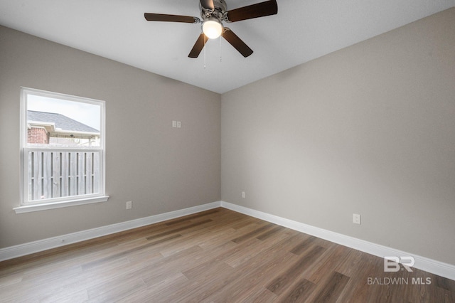 spare room featuring ceiling fan and light hardwood / wood-style flooring