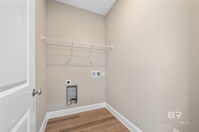 washroom featuring washer hookup, hardwood / wood-style floors, and hookup for an electric dryer