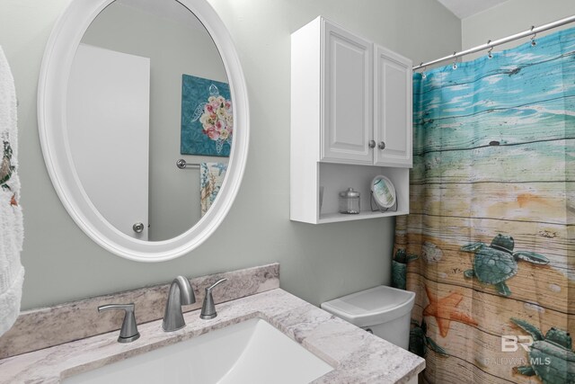728 W Beach Blvd Unit 104, Gulf Shores, AL 36542 - bathroom with vanity and toilet