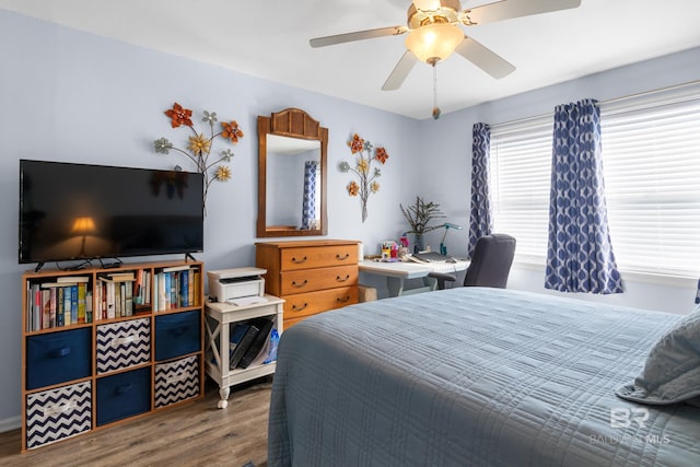728 W Beach Blvd Unit 104, Gulf Shores, AL 36542 - bedroom featuring a ceiling fan and wood finished floors