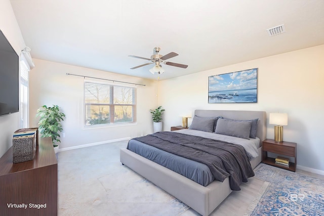 bedroom with multiple windows and ceiling fan