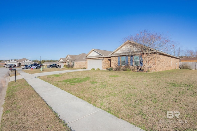 ranch-style home featuring a front yard and a garage